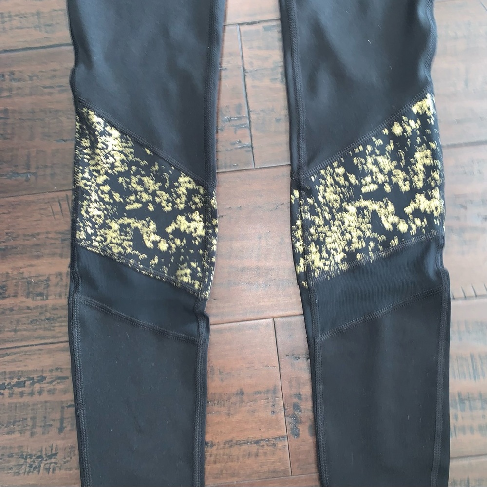 Gaiam Black Leggings with Gold Accent and Mesh Panels - Picture 3 of 10